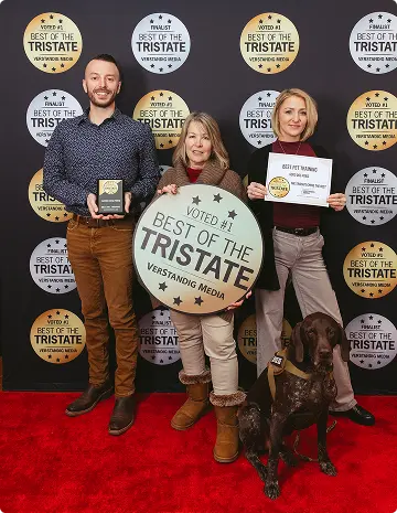 Pictured on the left is trainer. Center is owner Helen Carlson and on the right is trainer posing for Tri-State Best Pet Training of 2026